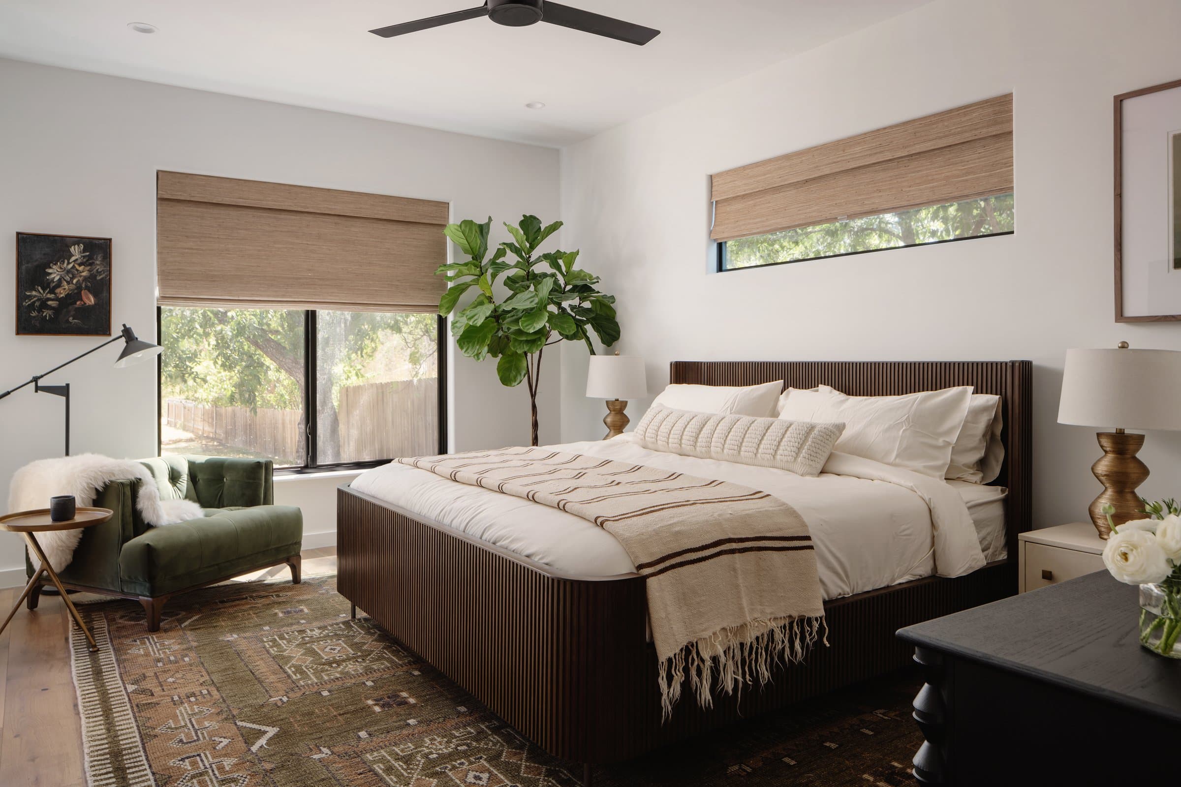 Master bedroom with dark ribbed headboard at Casa Alegre Fredericksburg Texas