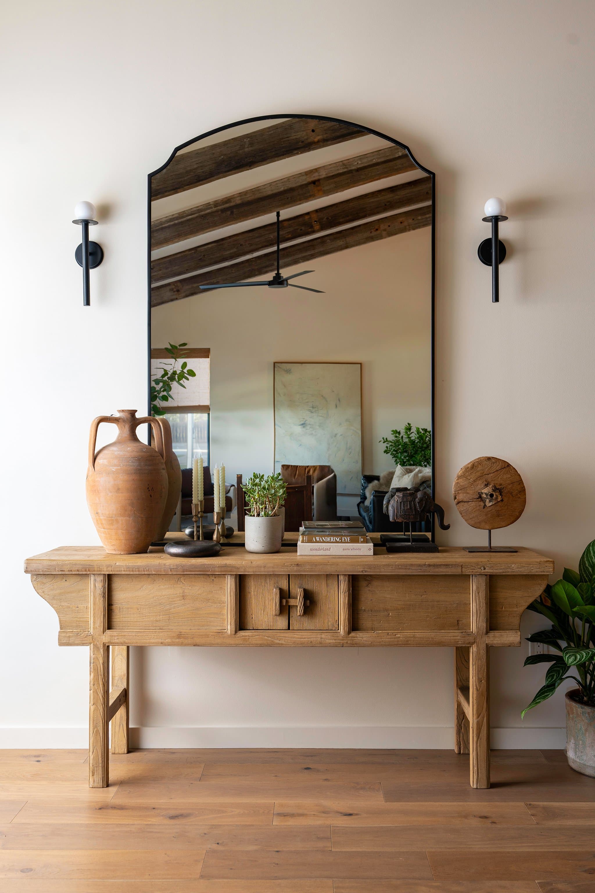 Entryway console table with arched mirror at Casa Alegre Fredericksburg Texas